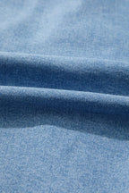 Close-up of blue denim fabric with visible texture
