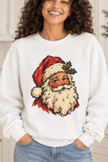 The Doodled Flower Boutique white crewneck sweatshirt featuring a vintage Santa portrait with a holly sprig graphic, close up.