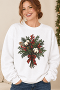 The Doodled Flower Boutique white crewneck sweatshirt featuring a cotton bouquet with red berries and a plaid bow graphic, close up.