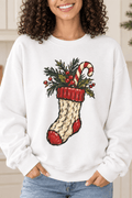 The Doodled Flower Boutique white crewneck sweatshirt featuring a cable knit Christmas stocking with greenery and a candy cane graphic, close up.