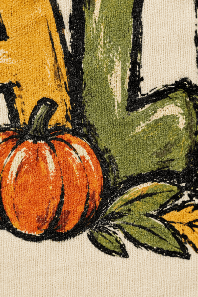 The Doodled Flower Boutique ivory cotton sweatshirt featuring a vintage-style pumpkin and autumn leaf graphic print.