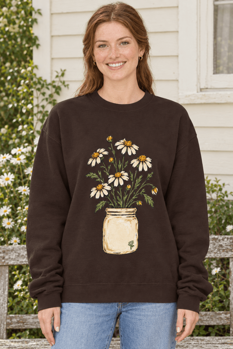 The Doodled Flower Boutique dark brown crewneck sweatshirt featuring a hand-drawn daisy bouquet in a vintage jar.