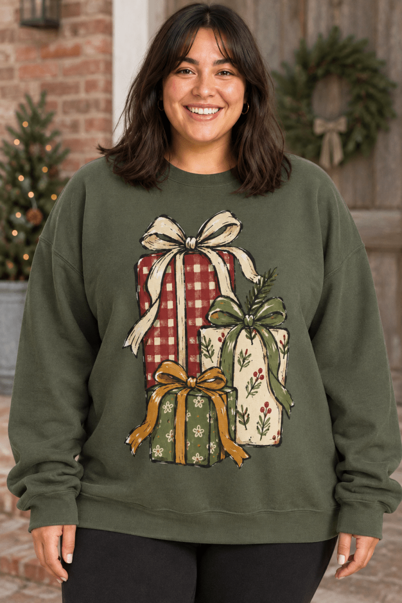 The Doodled Flower Boutique olive green crewneck sweatshirt featuring a hand-drawn Christmas gift stack illustration.