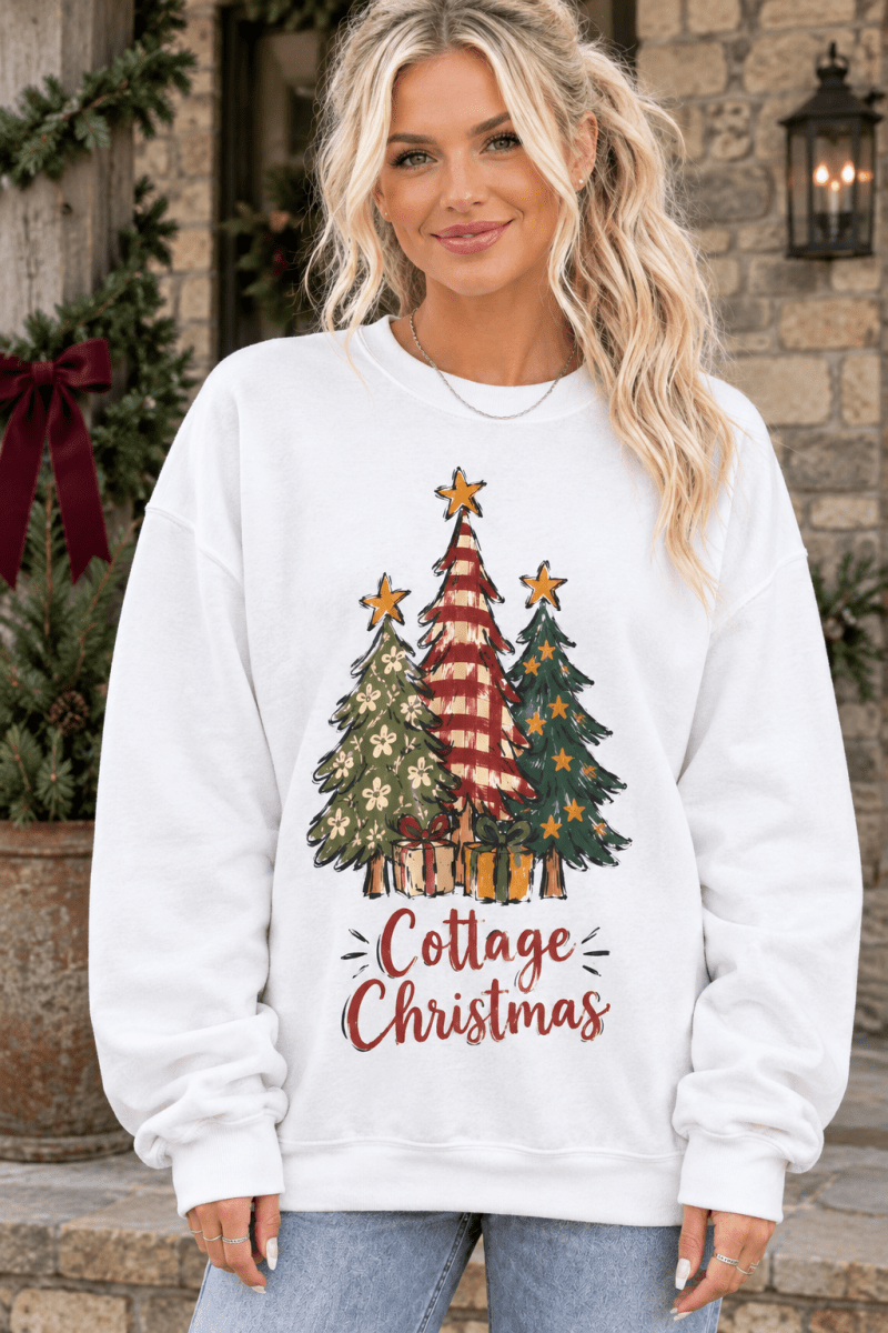 The Doodled Flower Boutique cream crewneck sweatshirt with a festive hand-drawn Christmas tree graphic on a model.