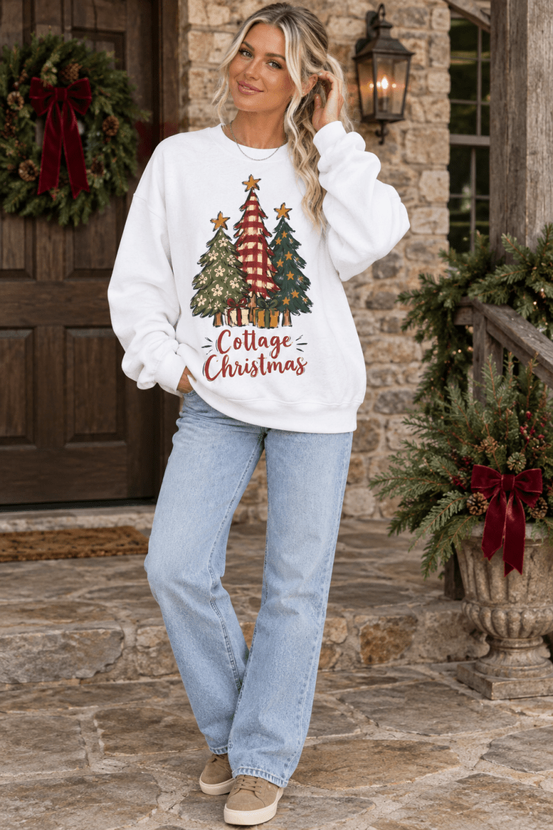 The Doodled Flower Boutique cream fleece sweatshirt featuring a festive hand-drawn Christmas tree graphic and text.