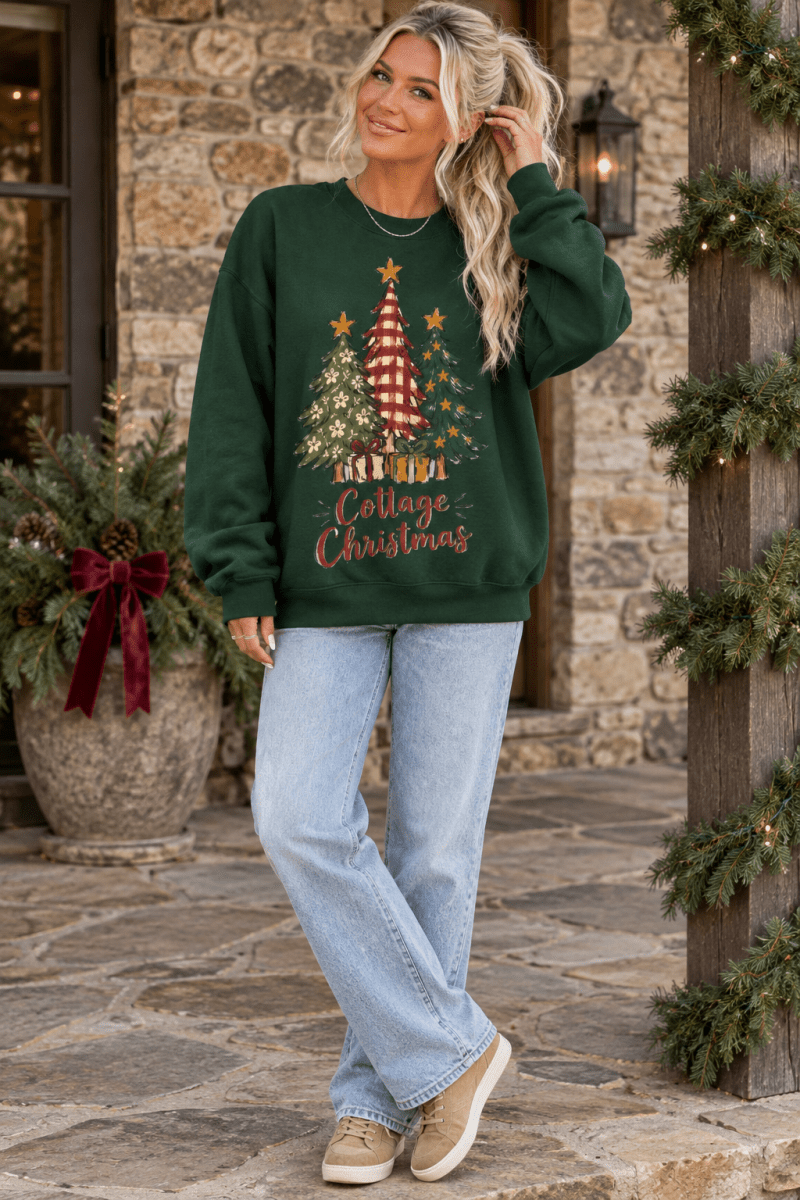 The Doodled Flower Boutique dark green crewneck sweatshirt with a festive Christmas tree graphic and cottage charm.
