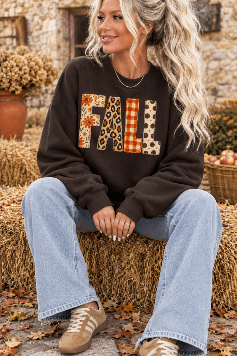 The Doodled Flower Boutique dark chocolate crewneck sweatshirt with mixed-print FALL lettering in floral and plaid.