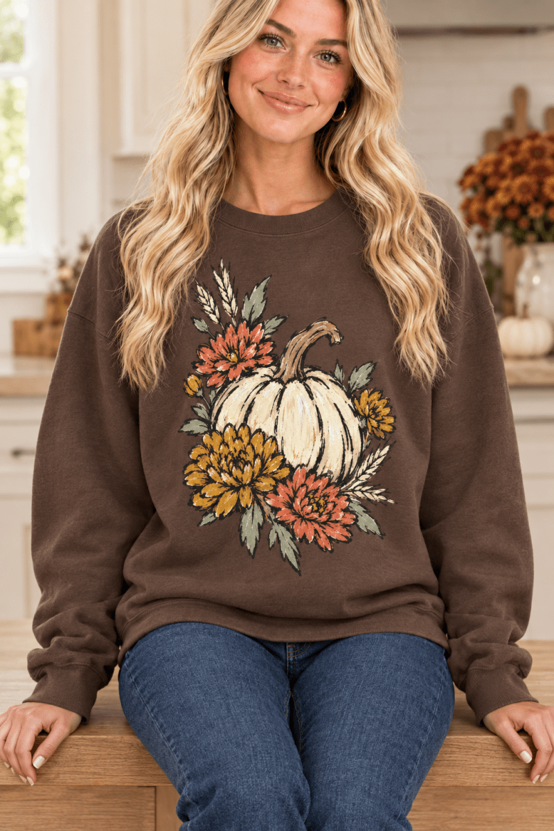 The Doodled Flower Boutique espresso brown crewneck sweatshirt featuring a hand-drawn ivory pumpkin and floral print.