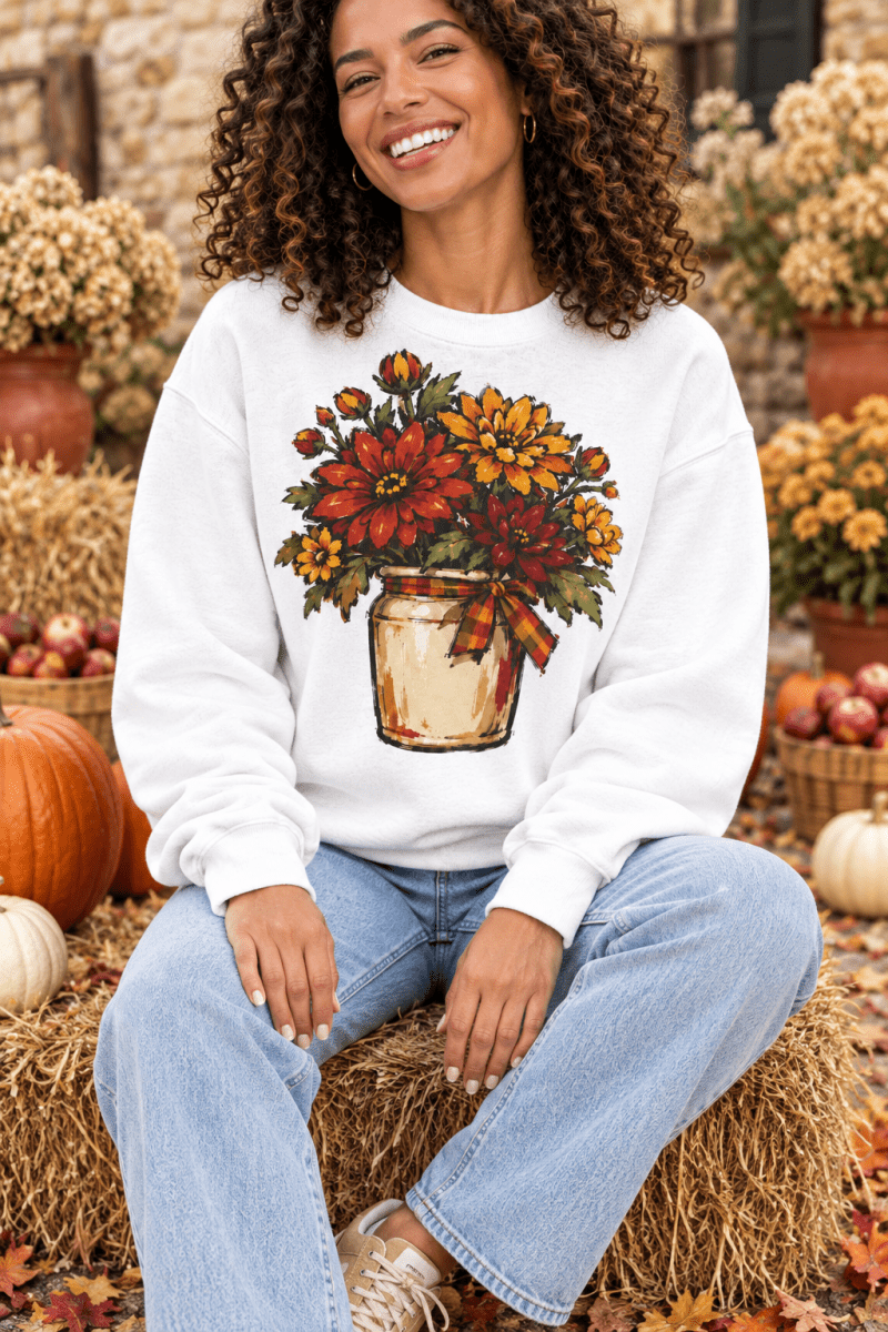 The Doodled Flower Boutique cream crewneck sweatshirt featuring a hand-drawn fall mum floral bouquet in a crock.