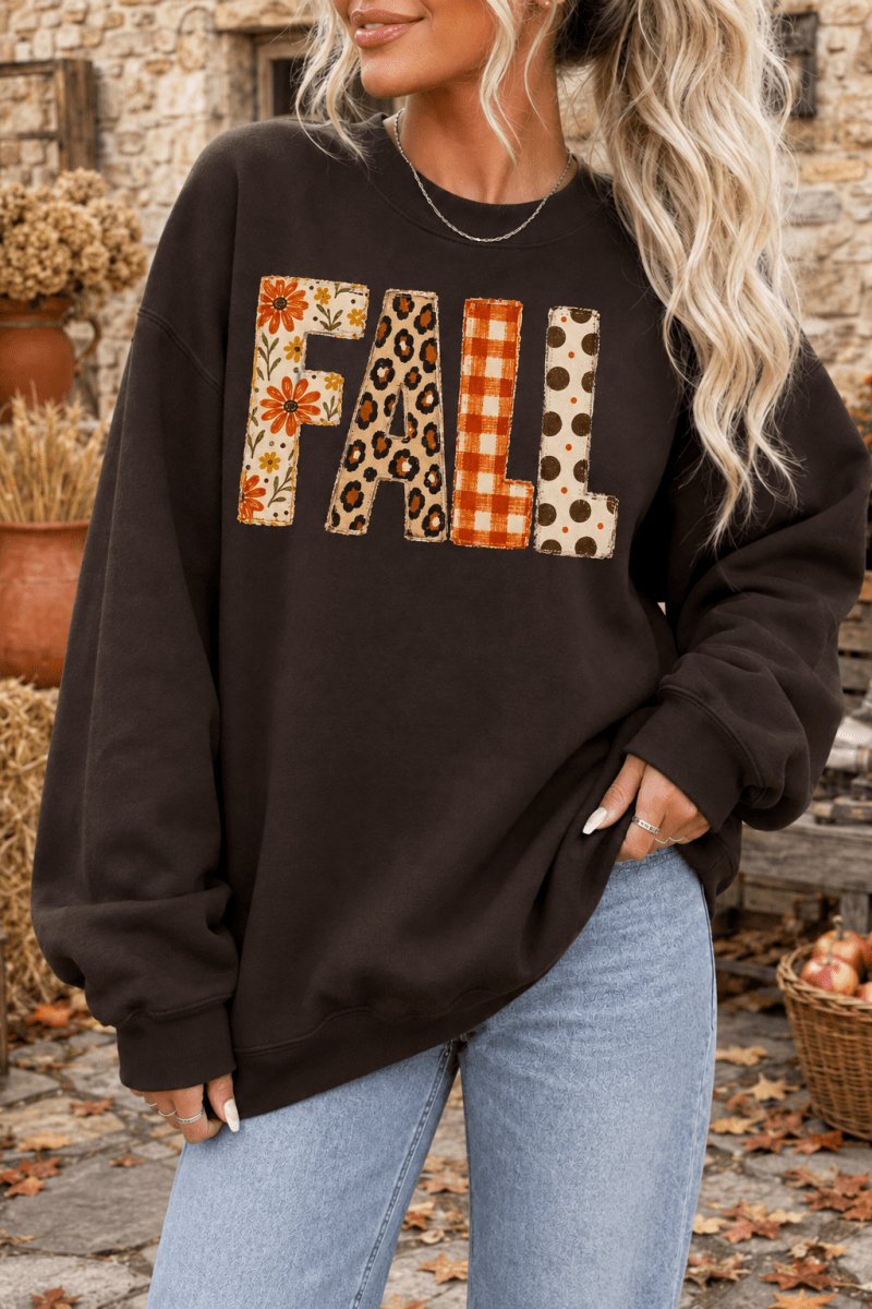 The Doodled Flower Boutique dark chocolate crewneck sweatshirt with mixed-print FALL patch lettering in autumn tones.