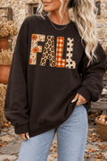 The Doodled Flower Boutique dark chocolate crewneck sweatshirt with mixed-print FALL patch lettering in autumn tones.