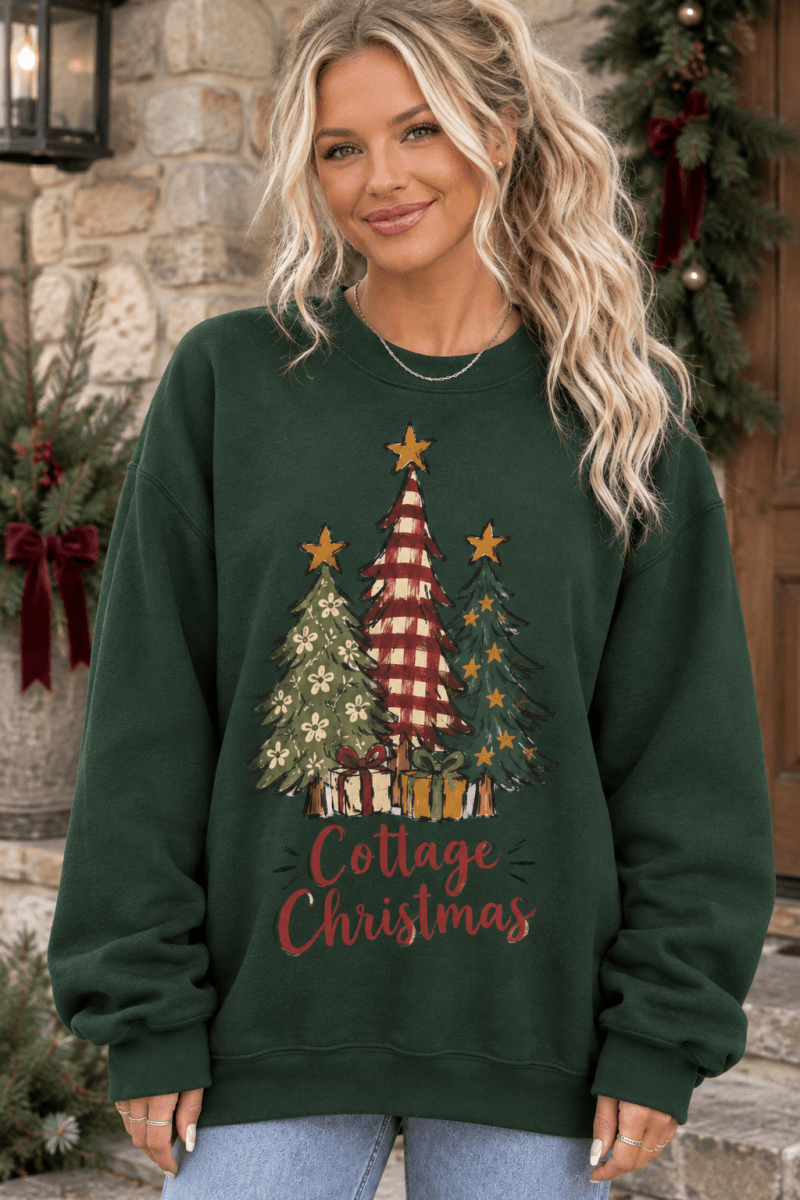 The Doodled Flower Boutique dark green crewneck sweatshirt featuring a hand-drawn Christmas tree graphic on a model.