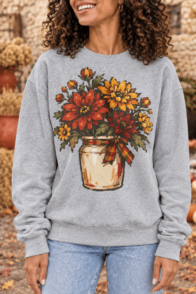 The Doodled Flower Boutique grey crewneck sweatshirt featuring a hand-drawn fall mum bouquet in a crock with a bow.