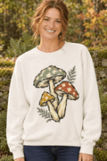 Woman wearing The Doodled Flower Boutique ivory crewneck sweatshirt with vintage botanical mushroom trio illustration