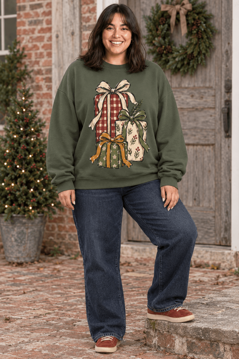 The Doodled Flower Boutique olive green crewneck sweatshirt featuring a hand-drawn Christmas gift stack illustration.