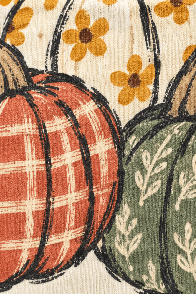 The Doodled Flower Boutique ivory crewneck featuring a hand-drawn pumpkin trio with orange plaid and sage floral art.
