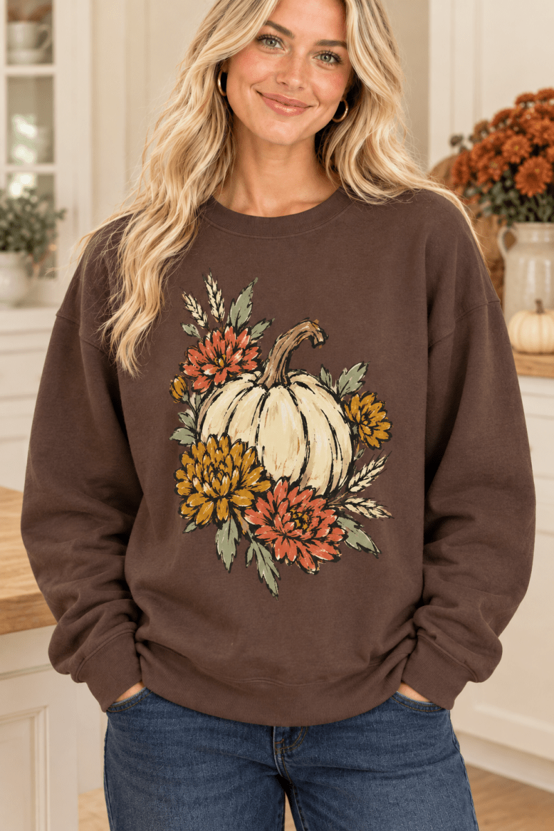 The Doodled Flower Boutique espresso brown cotton crewneck sweatshirt featuring a hand-drawn pumpkin and floral print.