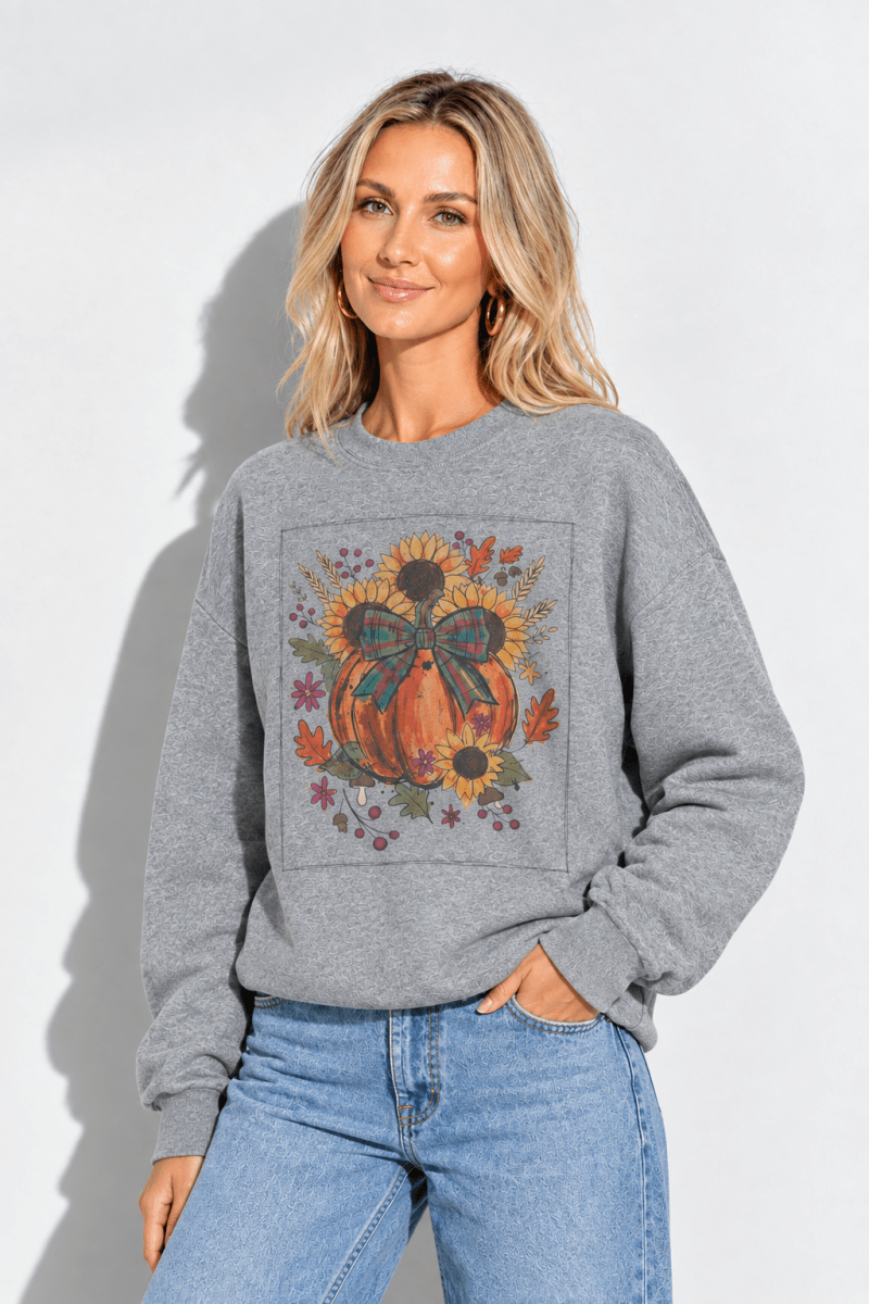 Model wearing The Doodled Flower Boutique graphite heather grey crewneck sweatshirt with pumpkin and sunflower print.