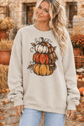 The Doodled Flower Boutique cream crewneck sweatshirt featuring a hand-drawn stacked pumpkin and plaid scarf design.
