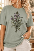 The Doodled Flower Boutique sage green cotton t-shirt featuring a hand-drawn botanical sage illustration.